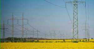 5g towers and cell towers on a field of yellow flowers to help with searching 5g towers near me